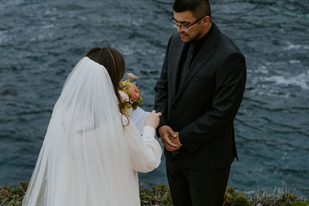 bride and groom private vow exchange on a cliff at Big Sur