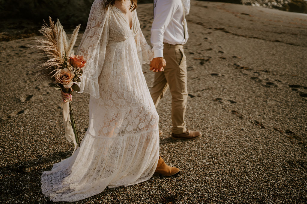 elopement couple walking hand in hand