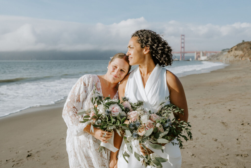 lgbtq elopement couple at the San Francisco beach shore
