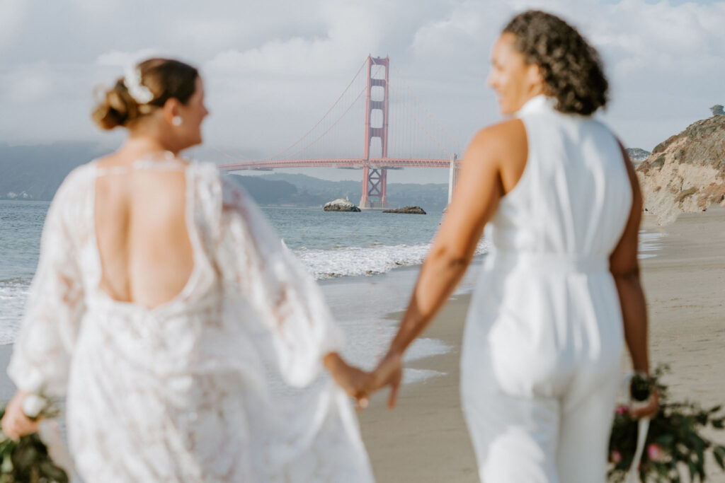 lgbtq elopement couple at the San Francisco beach shore
