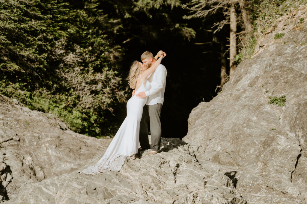 bride and groom kissing during their California beach elopement