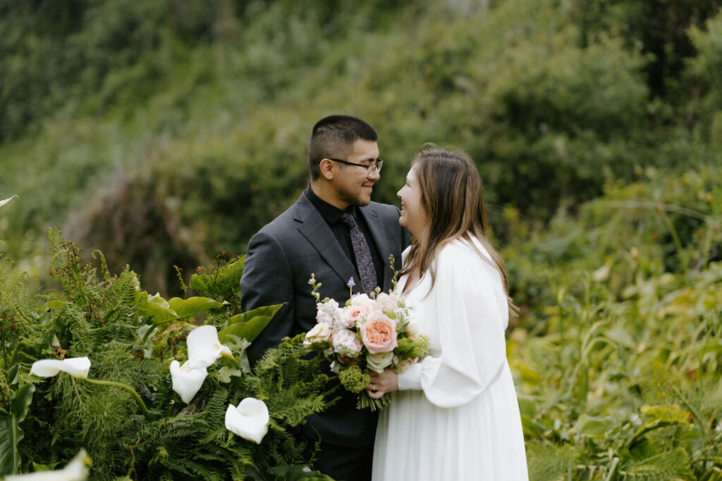 bride and groom exploring Calla Lily Valley during their Big Sur elopement day
