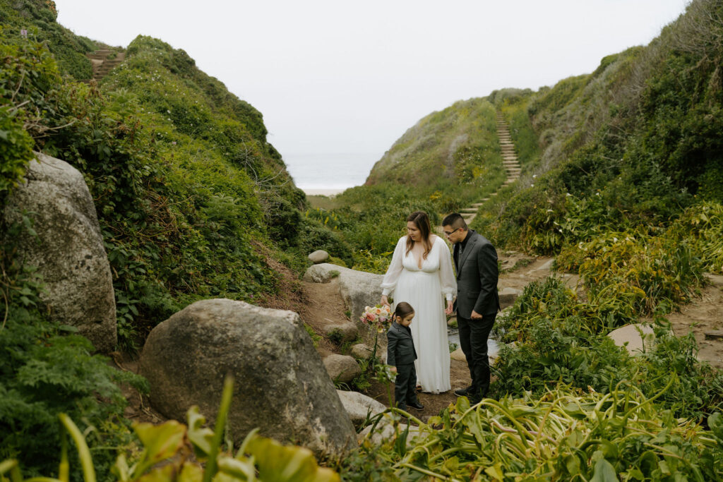 bride and groom exploring Calla Lily Valley during their Big Sur elopement day