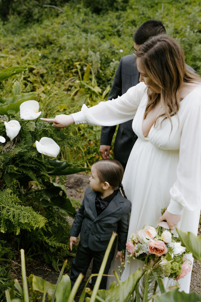 bride and groom exploring Calla Lily Valley during their Big Sur elopement day