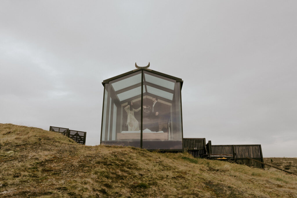 playful couple in bed at Panorama Glass Lodge in Icelandic Highlands