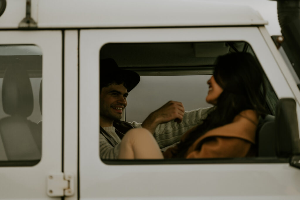 sweet couple in a jeep going through iceland highlands