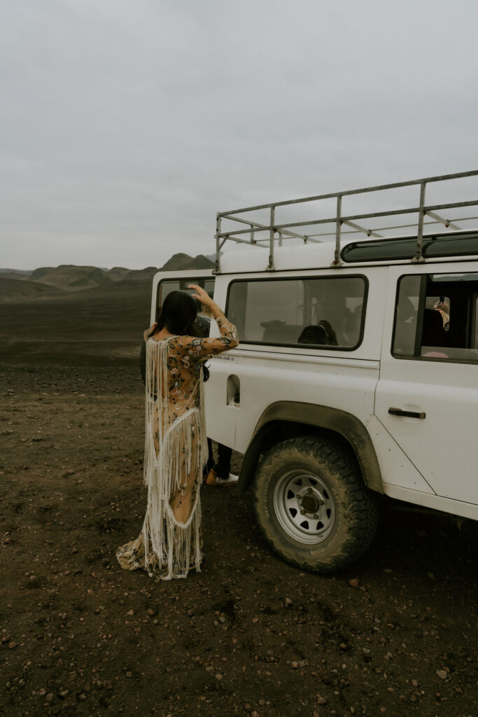 bride getting ready next to a 4x4 land rover