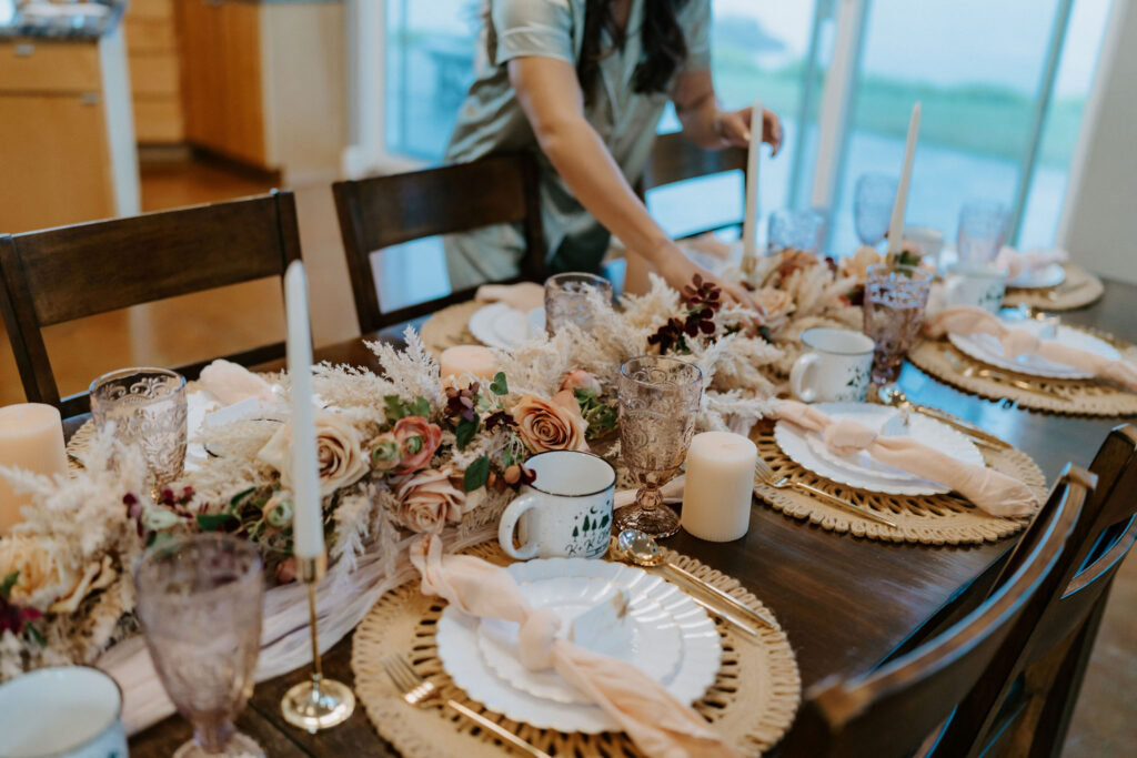 small reception table decorated with boho colors and florals for an intimate lunch with family