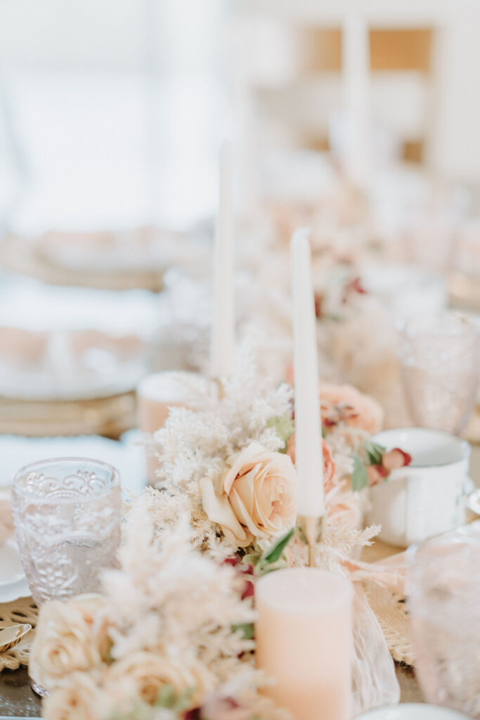 small reception table decorated with boho colors and florals for an intimate lunch with family