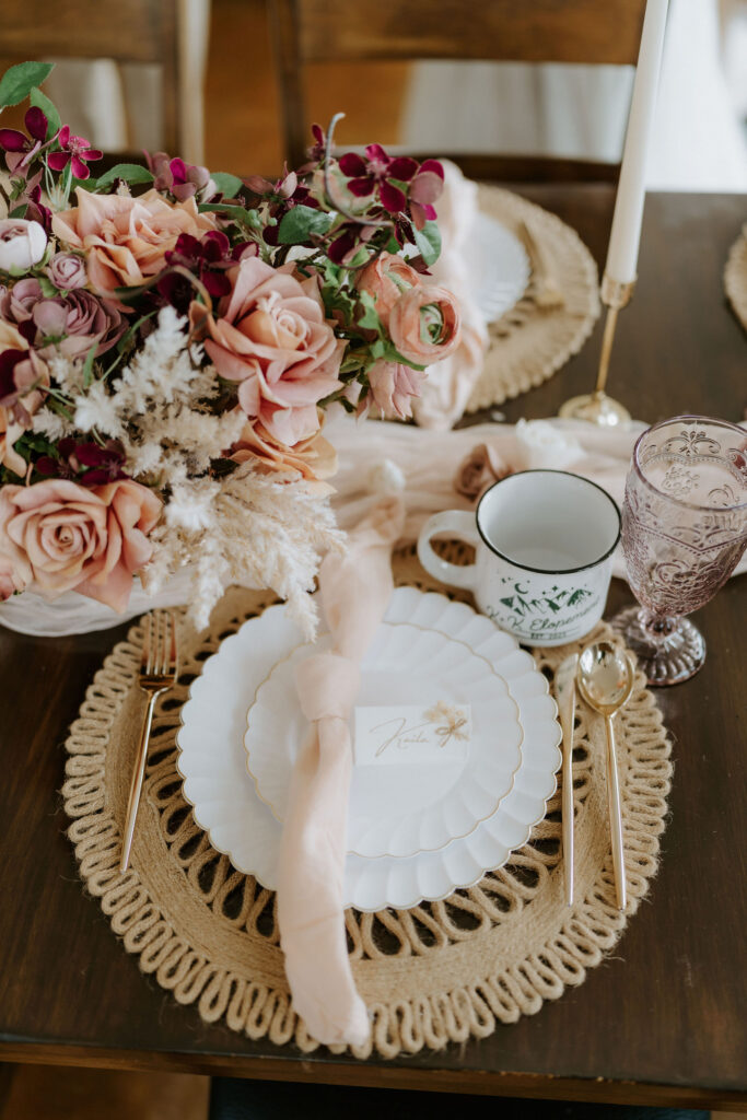 small reception table decorated with boho colors and florals for an intimate lunch with family