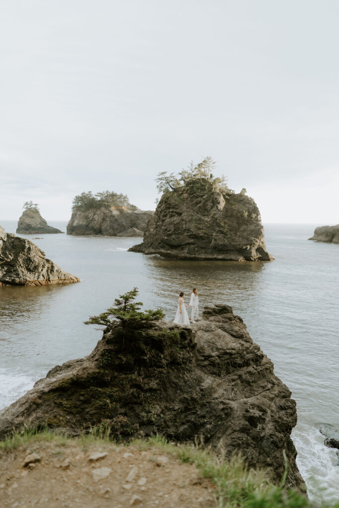 romantic moment of brides on a cliff at oregon coast