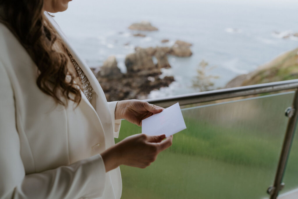 bride reading private letter on a balcony