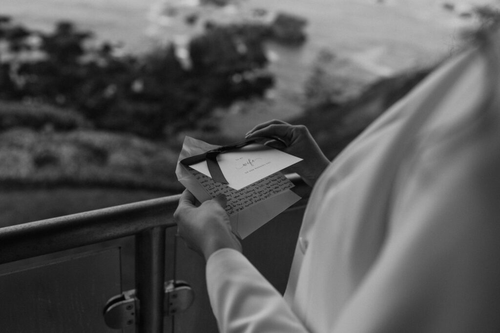 bride reading private letter on a balcony