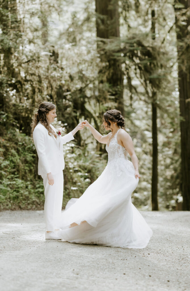 brides dancing surrounded by lush trees during their redwoods elopement in Jedediah Smith State Park