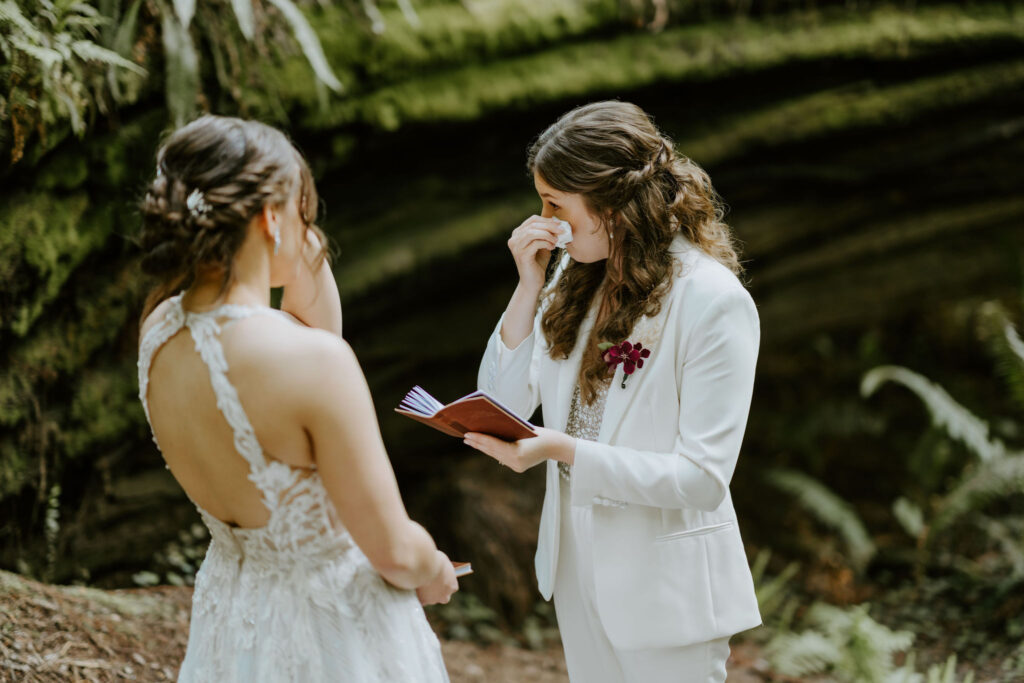 emotional brides during their redwoods elopement ceremony at Jedediah smith state park