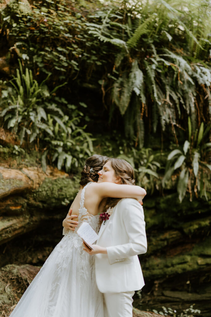 emotional brides during their redwoods elopement ceremony at Jedediah smith state park