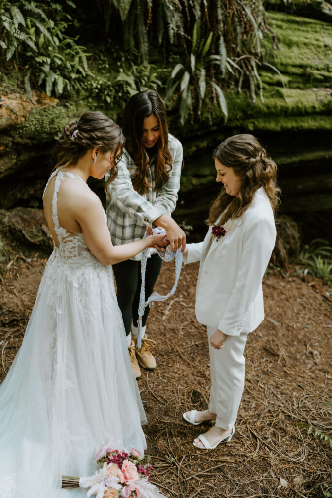 hand fasting ritual during a redwoods elopement ceremony at jedediah smith state park