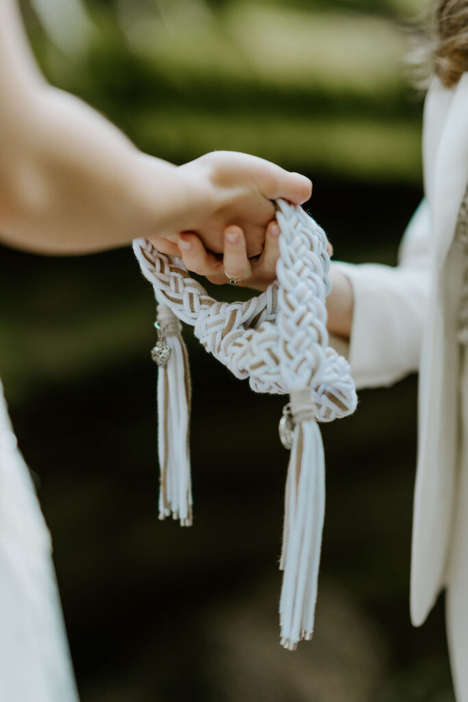 hand fasting ritual during a redwoods elopement ceremony at jedediah smith state park