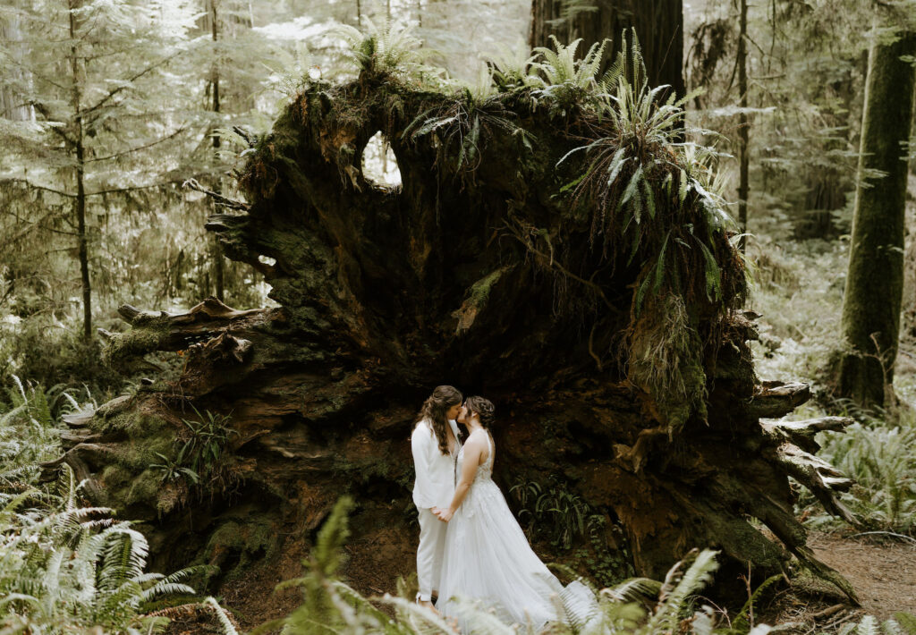 emotional brides during their redwoods elopement ceremony at Jedediah smith state park