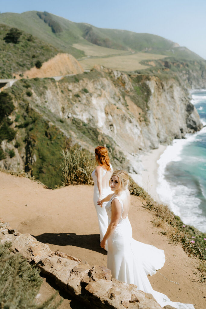 brides exploring the bixby bridge area during their big sur elopement day