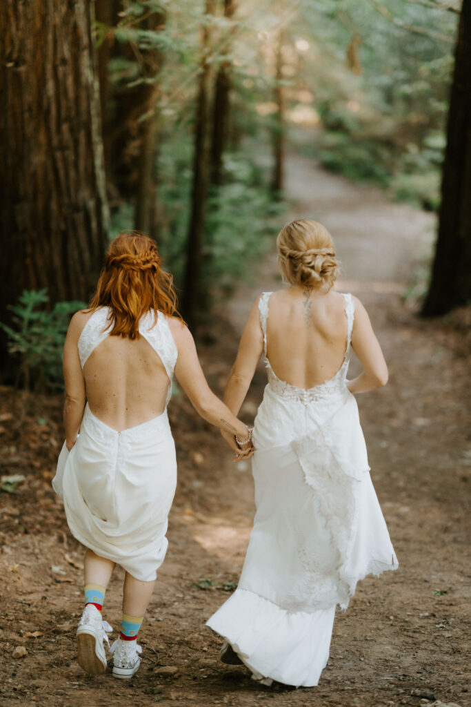 brides hiking through pfeiffer redwood state park