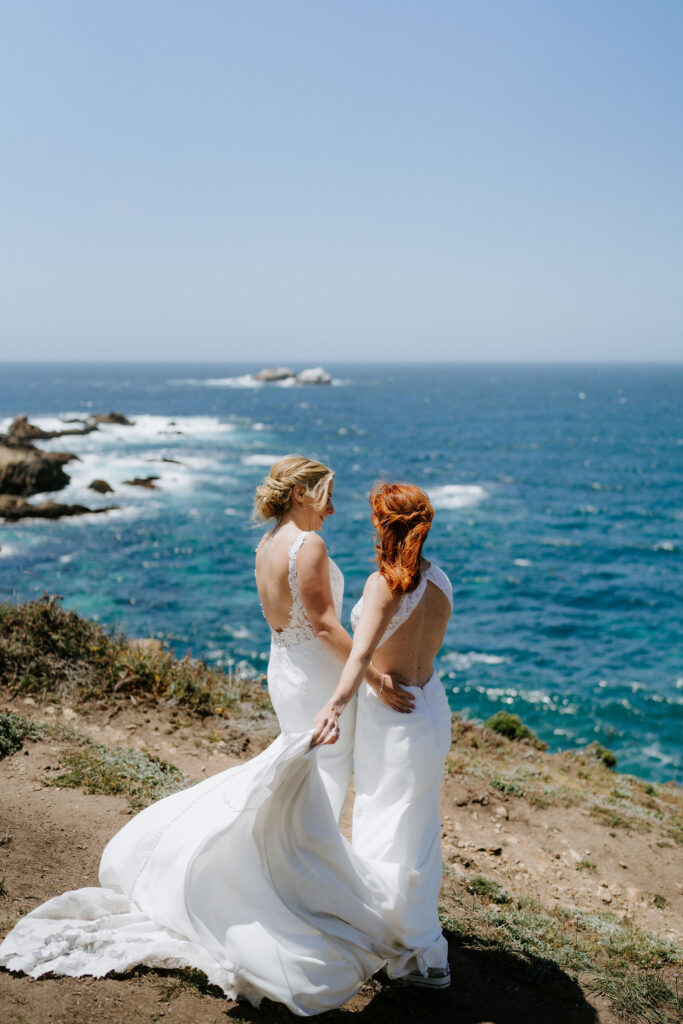 brides roaming around the cliffside in big sur with majestic ocean views