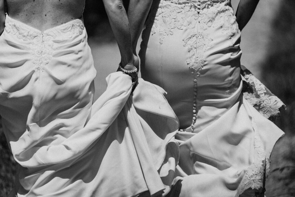 brides roaming around the cliffside in big sur with majestic ocean views