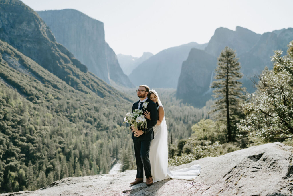 dreamy elopement couple in yosemite surrounded by mountain views