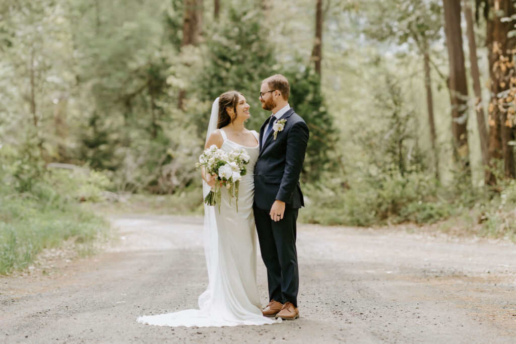 bride and groom in the forest at yosemite national park