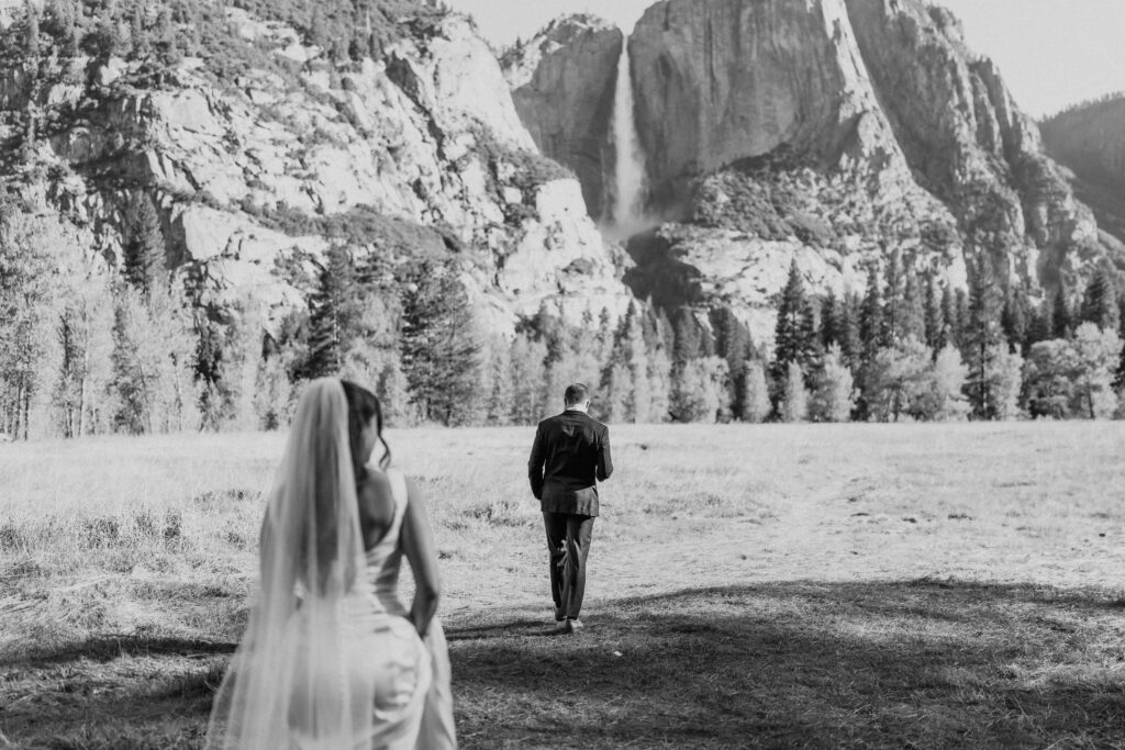 bride and groom hiking through yosemite national park