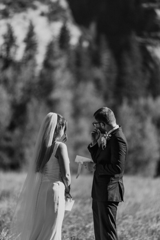 candid moments of bride and groom exchanging private vows in yosemite national park