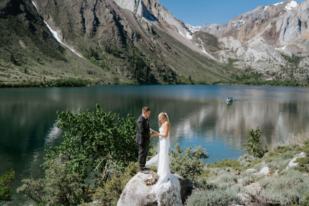 bride and groom exchanging private vows next to a gorgeous lake