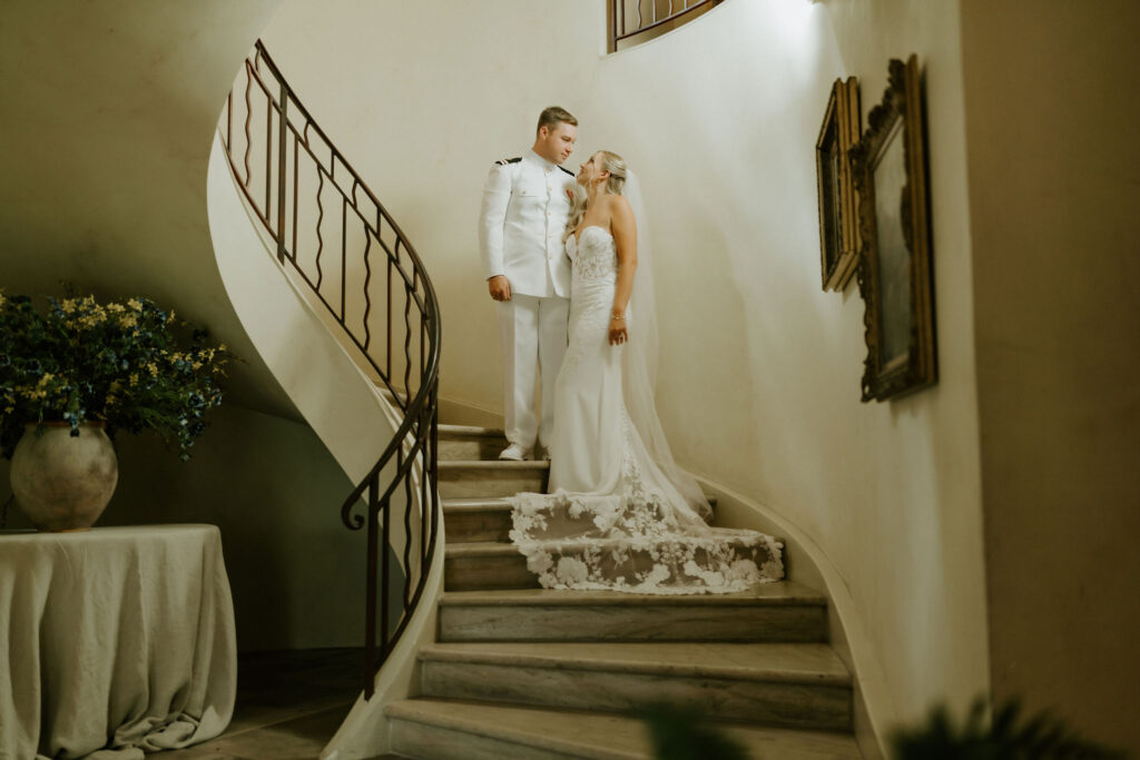 bride and groom on a winding staircase at their vrbo