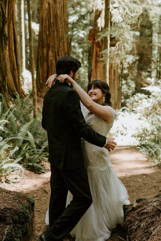 adventurous bride and groom moments surrounded by ancient redwoods as they elope in california