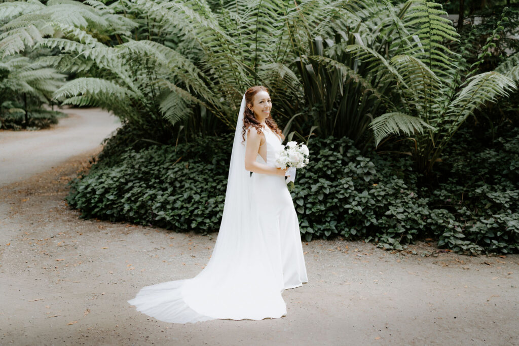 bridal portrait by lush ferns during their Glen Oaks Big Sur elopement