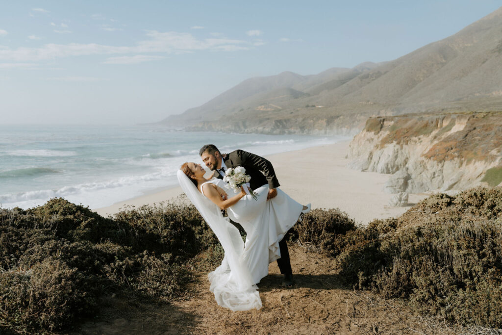 bride and groom dip kiss at garrapata state park