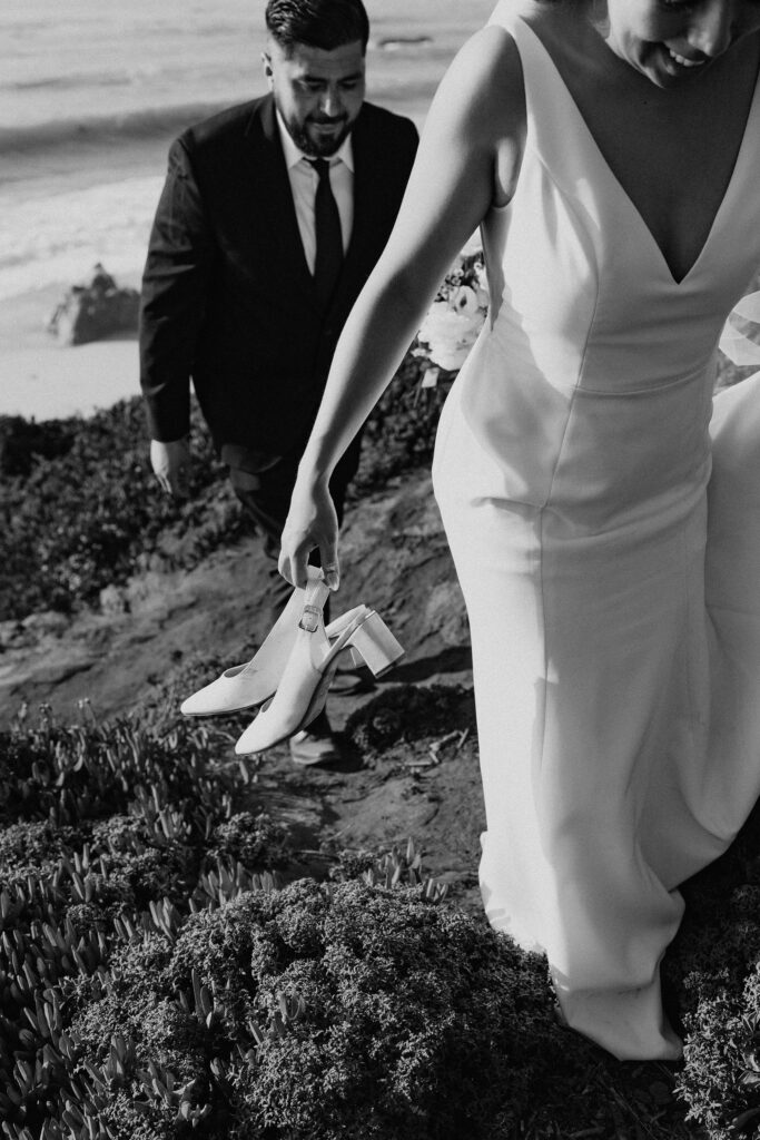 bride and groom in garrapata state park overlooking the ocean