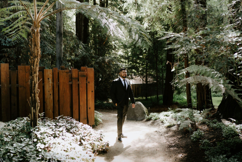 groom portrait by lush ferns during their Glen Oaks Big Sur elopement