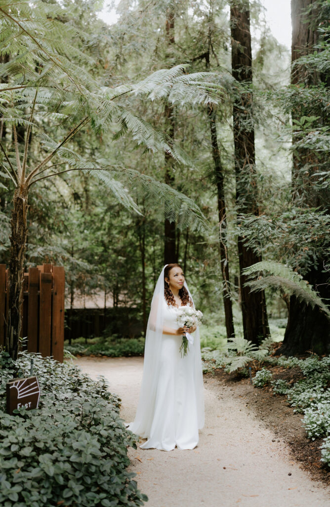 bridal portrait ahead of first look by lush ferns during their Glen Oaks Big Sur elopement