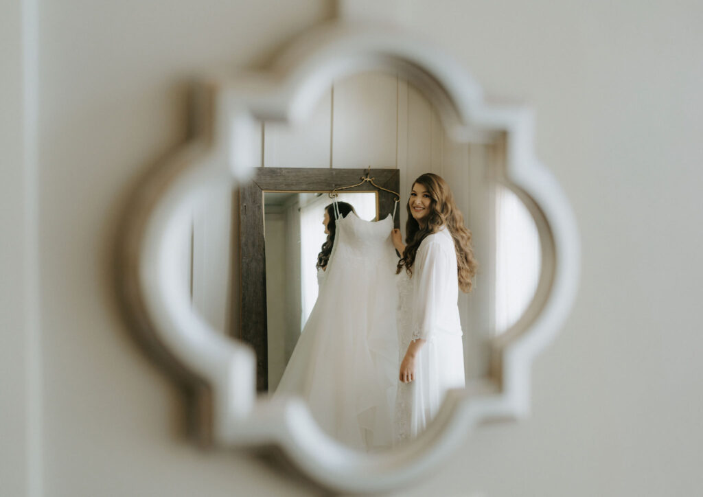 bride about to put on her wedding dress
