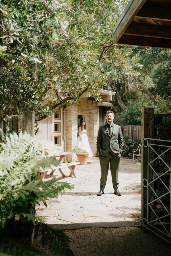 bride and groom first look in front of their airbnb