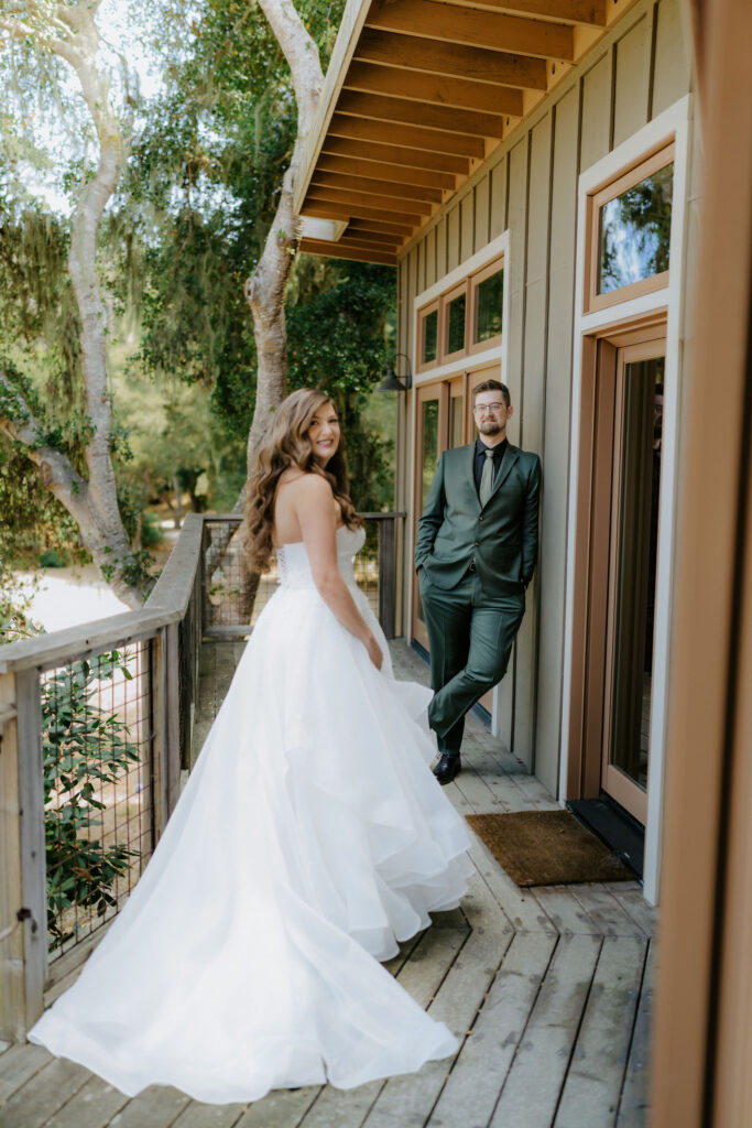 bride and groom first look in front of their airbnb