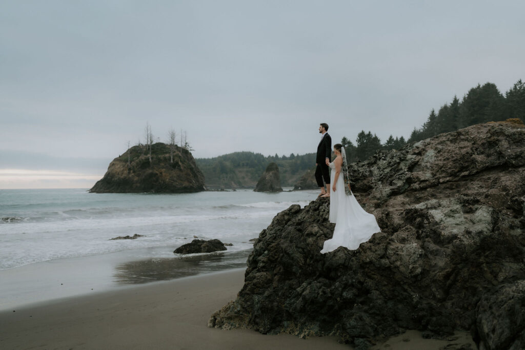 bride and groom barefoot at the shore during their Trinidad State Beach elopement