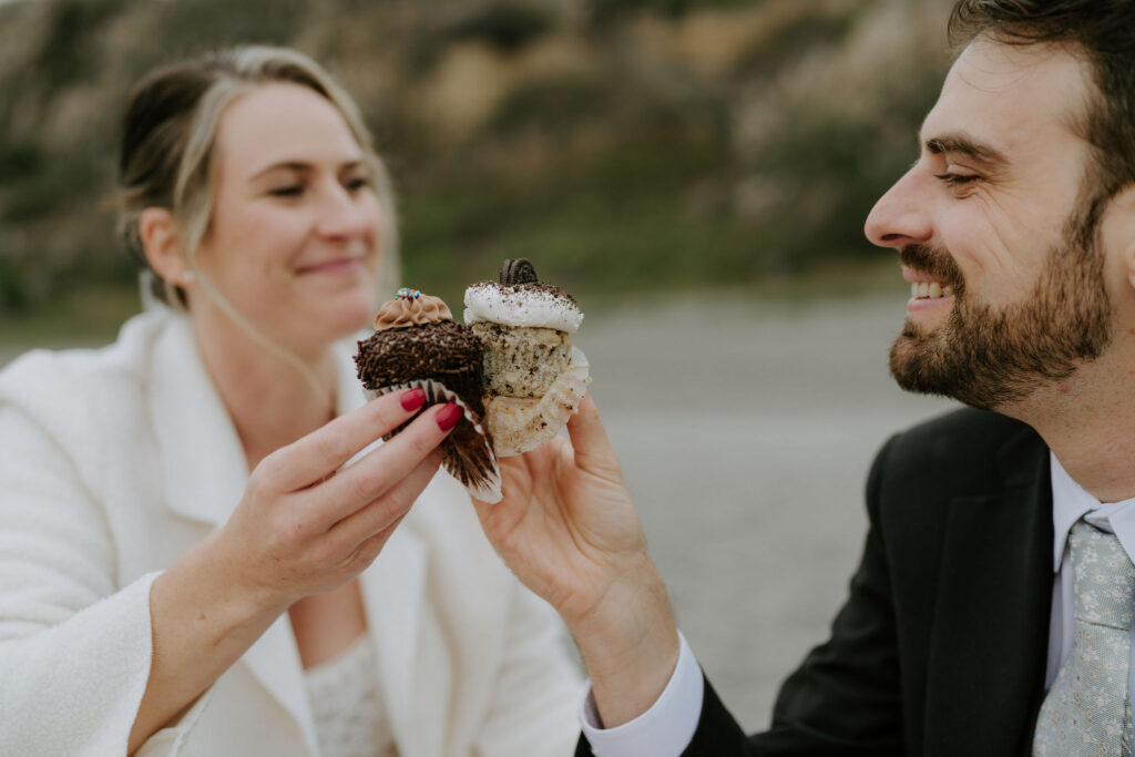 bride and groom sharing a picnic at the beach during their Trinidad State Beach elopement