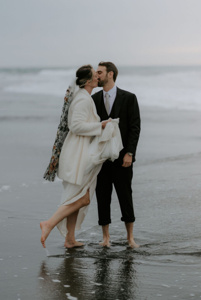bride and groom barefoot at the shore during their Trinidad State Beach elopement