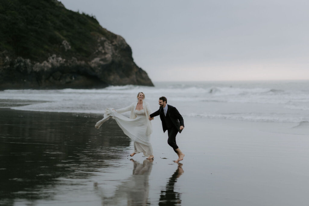 bride and groom barefoot at the shore during their Trinidad State Beach elopement