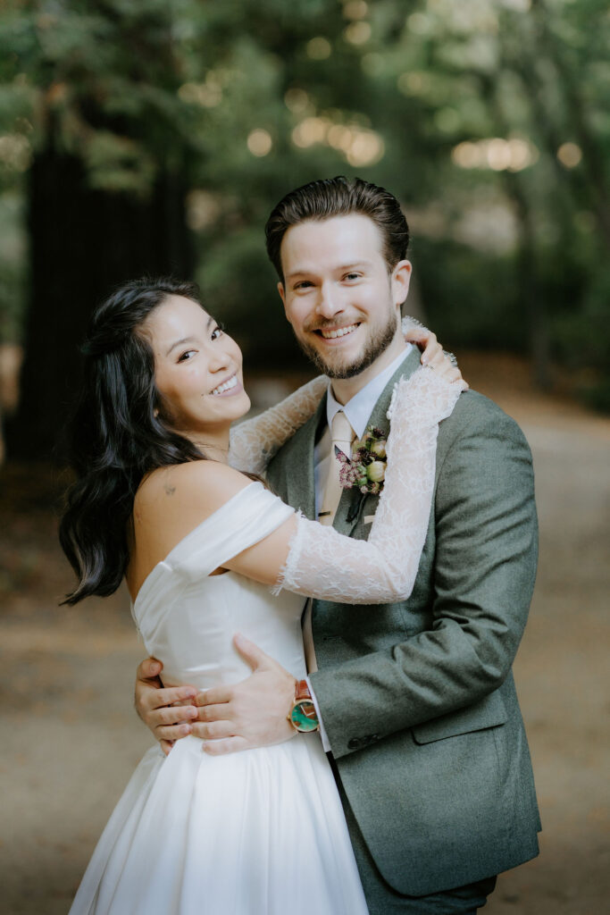 elopement couple hugging surrounded by big sur redwoods