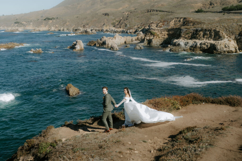 bride and groom on the rocky cliffs during their big sur coastal elopement 