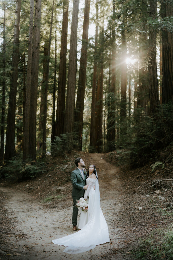 bride and groom surrounded by lush redwoods 