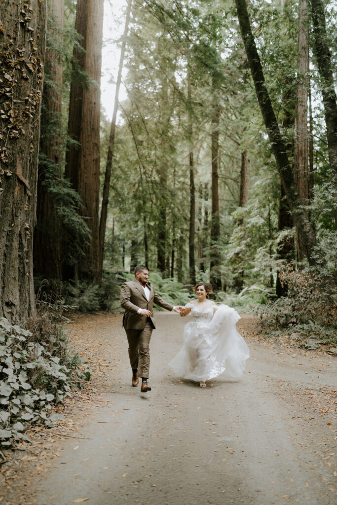 bride and groom surrounded by lush redwoods during their big sur fall elopement